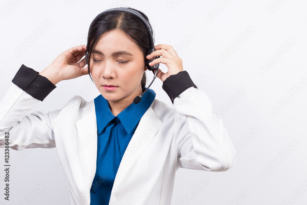 Operator or businesswoman in headset and she has headache Operator or businesswoman in headset and she has headache