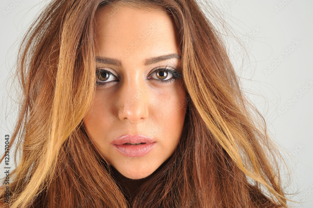 Women wearing black jacket and black socks and long leather boots with long brown hairs in studio on white isolated background Women wearing black jacket and black socks and long leather boots with long brown hairs in studio on white isolated background