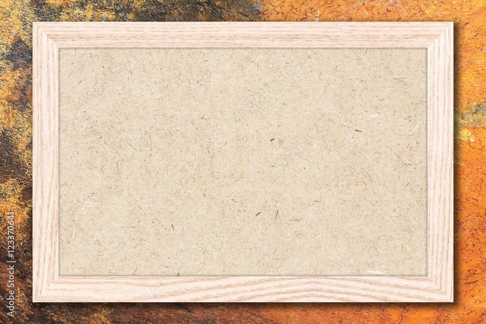 Fototapeta premium Chipboard or Empty bulletin board with a wooden frame on cement wall background with copy space for text or image.