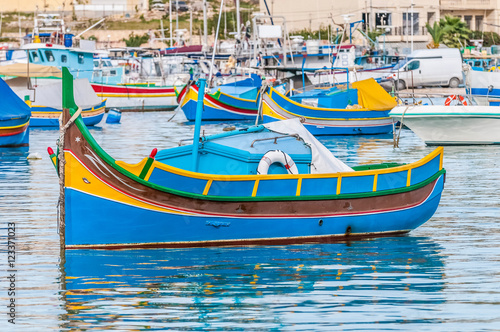 Traditional Luzzu boat at Marsaxlokk harbor in Malta.