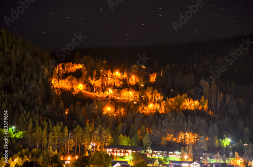 serpentine mountain road illuminating night light
