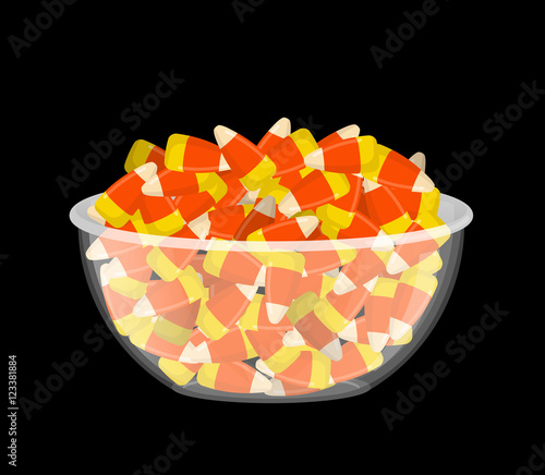 Bowl and candy corn. Sweets on plate. Traditional Treats for Hal