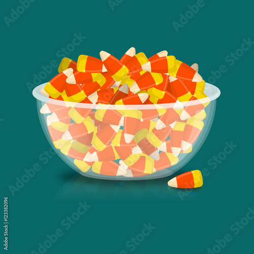 Bowl and candy corn. Sweets on plate. Traditional Treats for Hal