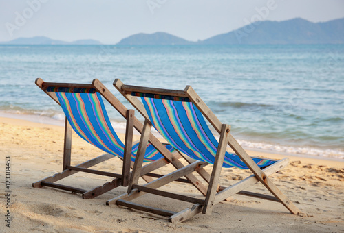 Two beach chairs on idyllic tropical beach. © arbalest