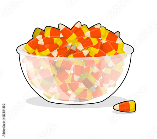 Bowl and candy corn. Sweets on plate. Traditional Treats for Hal