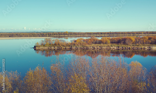 Fall River, reflected in the water autumn trees.