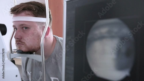 Man ready for checking his eye retina. Security guard scanning eye for access to restricted area. HD. photo