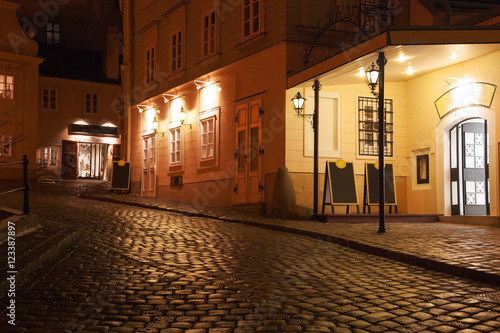 Illuminated cobbled street by late  evening   Vienna   Austria.