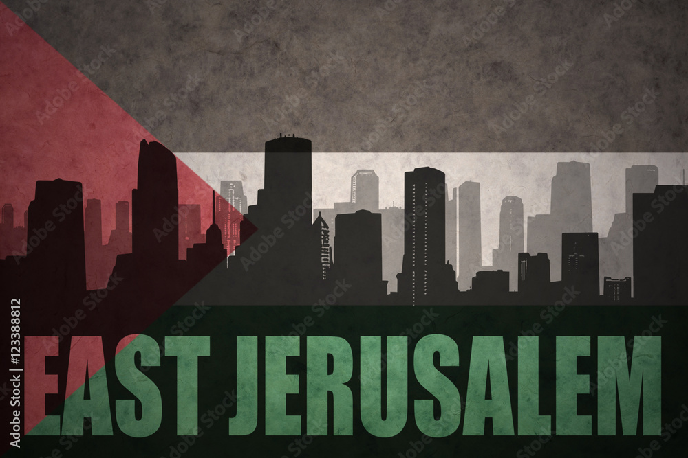 Fototapeta premium abstract silhouette of the city with text East Jerusalem at the vintage palestinian flag background