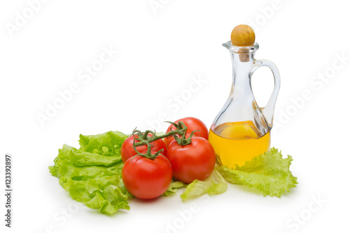 Set vegetable and jug of vegetable oil isolated on the white bac