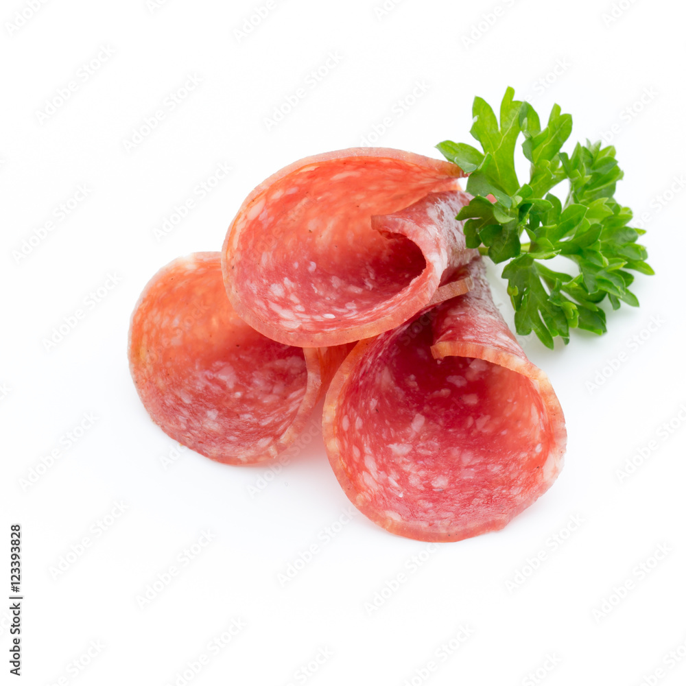 Salami smoked sausages slices isolated on white background.