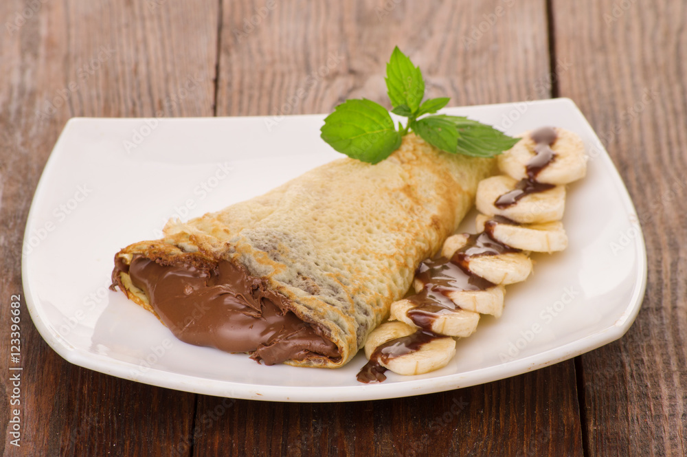 Crepes with chocolate cream and banana