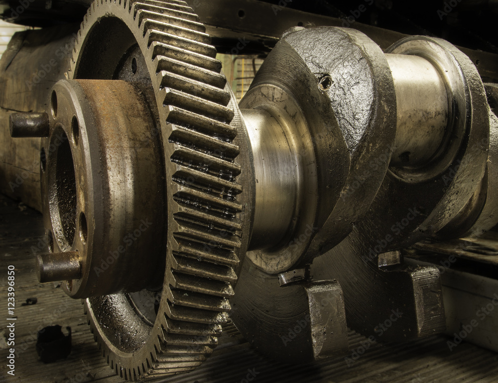 Close up of a crank shaft showing cog and camshaft. Close up of a crank shaft showing cog and camshaft.