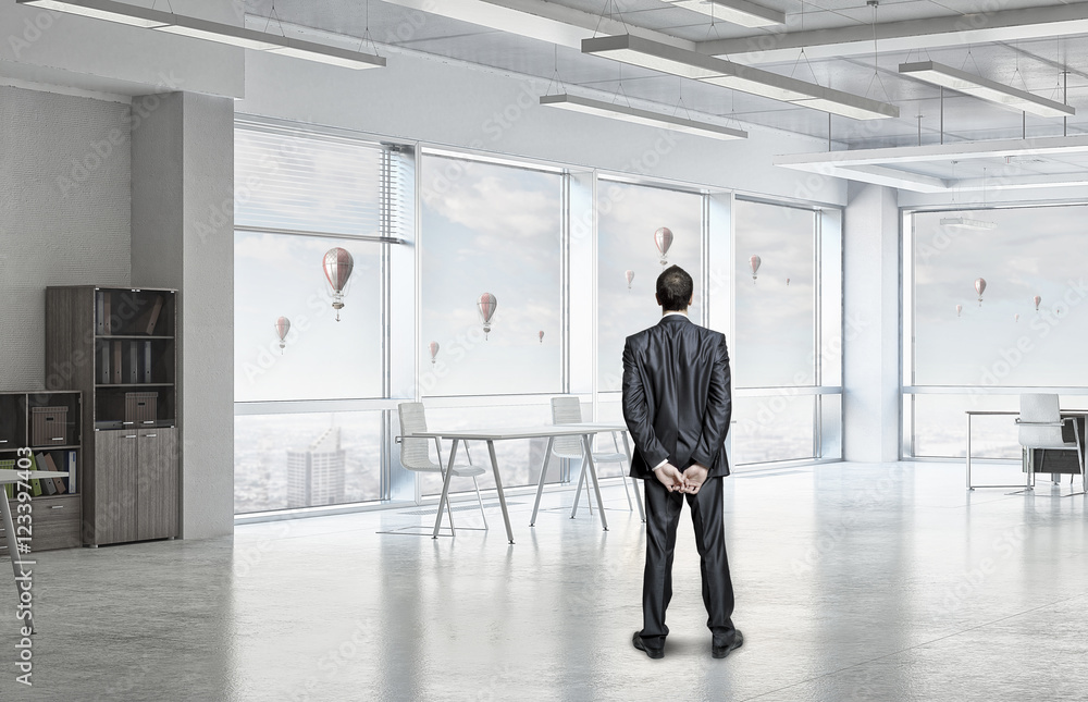 Pensive businessman in office . Mixed media Pensive businessman in office . Mixed media