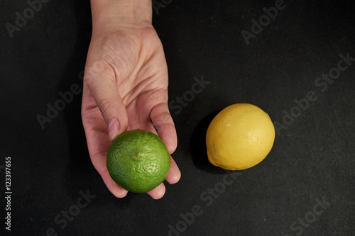 Hand offering green lime