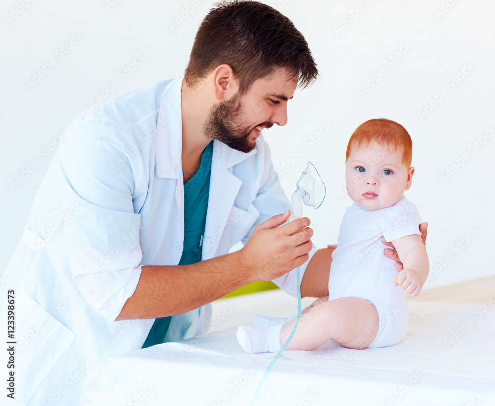 infant baby receives a nebulizer treatment through the facial mask infant baby receives a nebulizer treatment through the facial mask