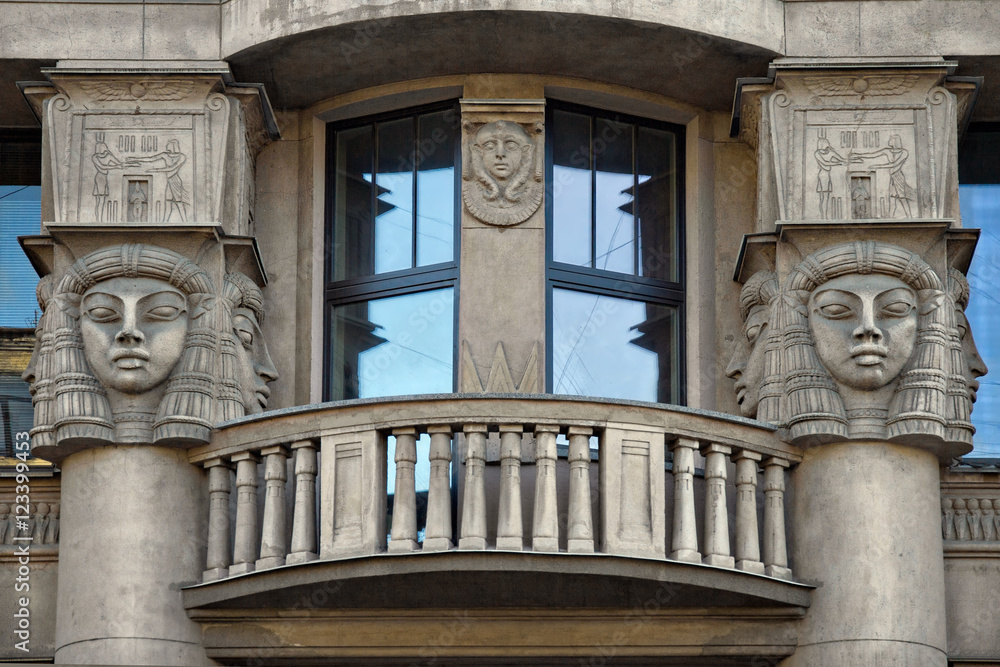 Windows with balcony decorated  Egyptian sculptures