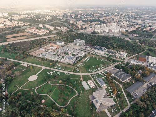 Aerial view of the Air park near city center. Airport terminal, airc rafts, roads, buildings. Poland, Krakow.