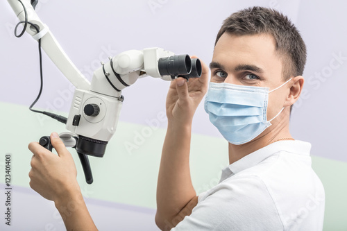 Dentist and a dental microscope