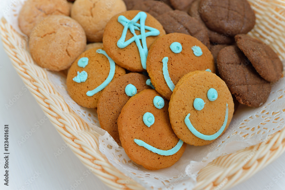 Funny smiling cookies in a food basket Funny smiling cookies in a food basket