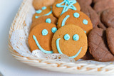 Funny smiling cookies in a food basket