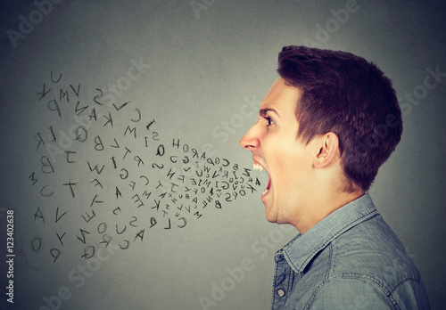 Tableau sur toile angry man screaming with alphabet letters flying out of open mouth