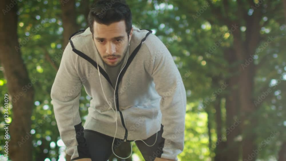 Tired Male Jogger Stopped to Catch his Breath During Morning Run. Shot on RED Cinema Camera in 4K (UHD). Tired Male Jogger Stopped to Catch his Breath During Morning Run. Shot on RED Cinema Camera in 4K (UHD).