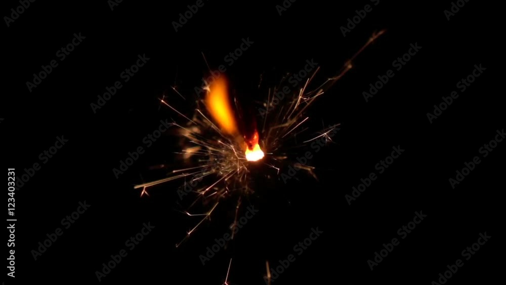 Sparkler burning over black background. Slow motion Sparkler burning over black background. Slow motion