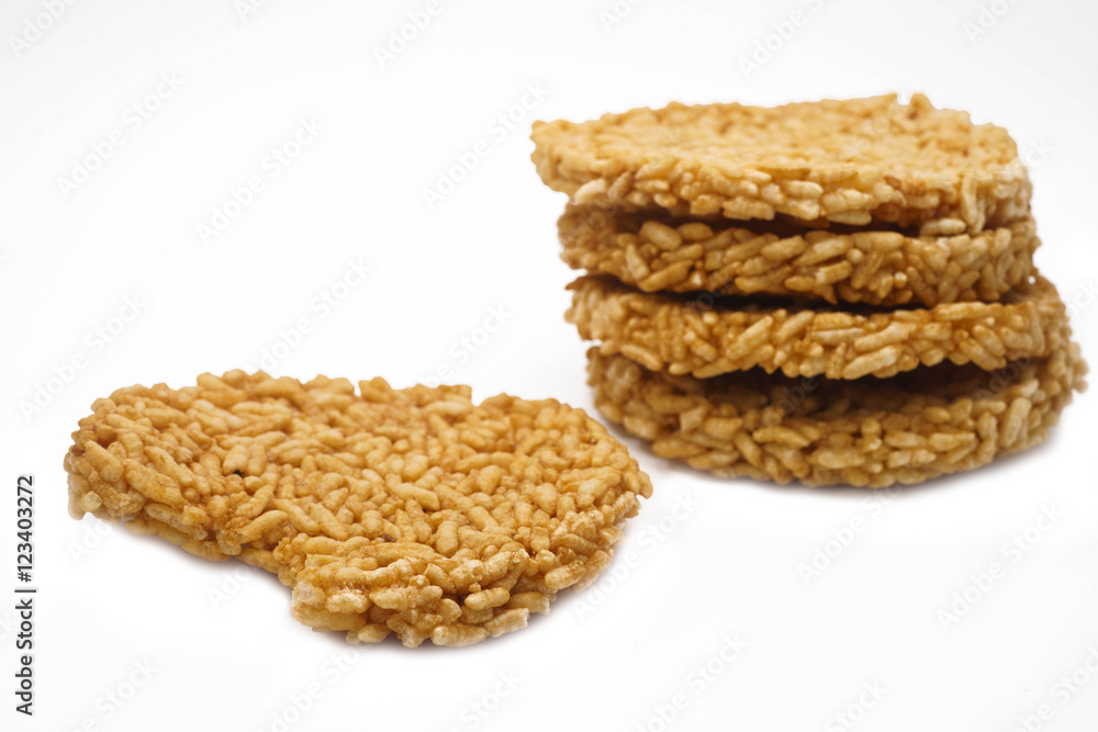 The Rice cracker or Khao tan is thai name pile up on white back The Rice cracker or Khao tan is thai name pile up on white back