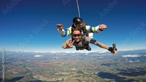 Skydiving tandem friends smiling