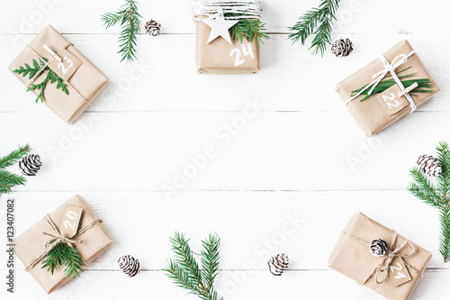 Christmas calendar. Christmas gift, fir branches, pine cones. Flat lay, top view