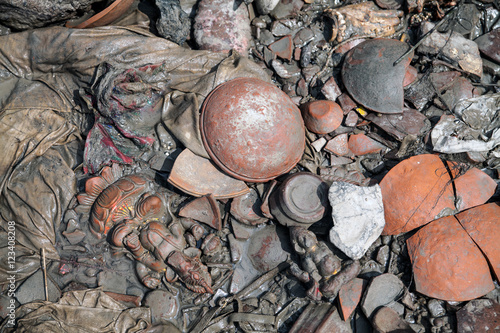 Floor of the Ganges river shore where people cremate their death and offer Ganesha statues to the river, Kolkata, India