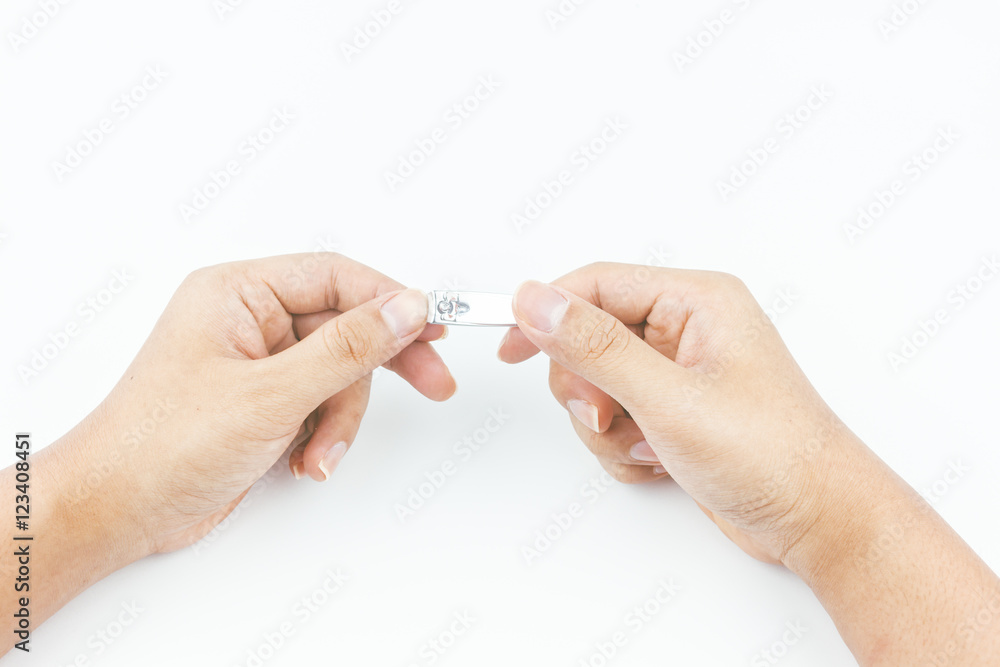 hand manicure with nail clipper on white background hand manicure with nail clipper on white background