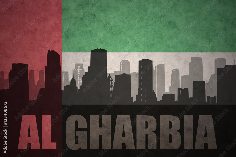 abstract silhouette of the city with text Al Gharbia at the vintage united arab emirates flag background