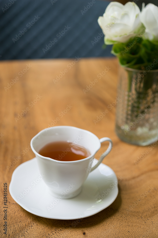 Cup of tea on wooden table. shallow depth of field
