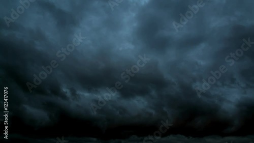 Night sky. The huge dark storm clouds. Dark blue night sky with clouds