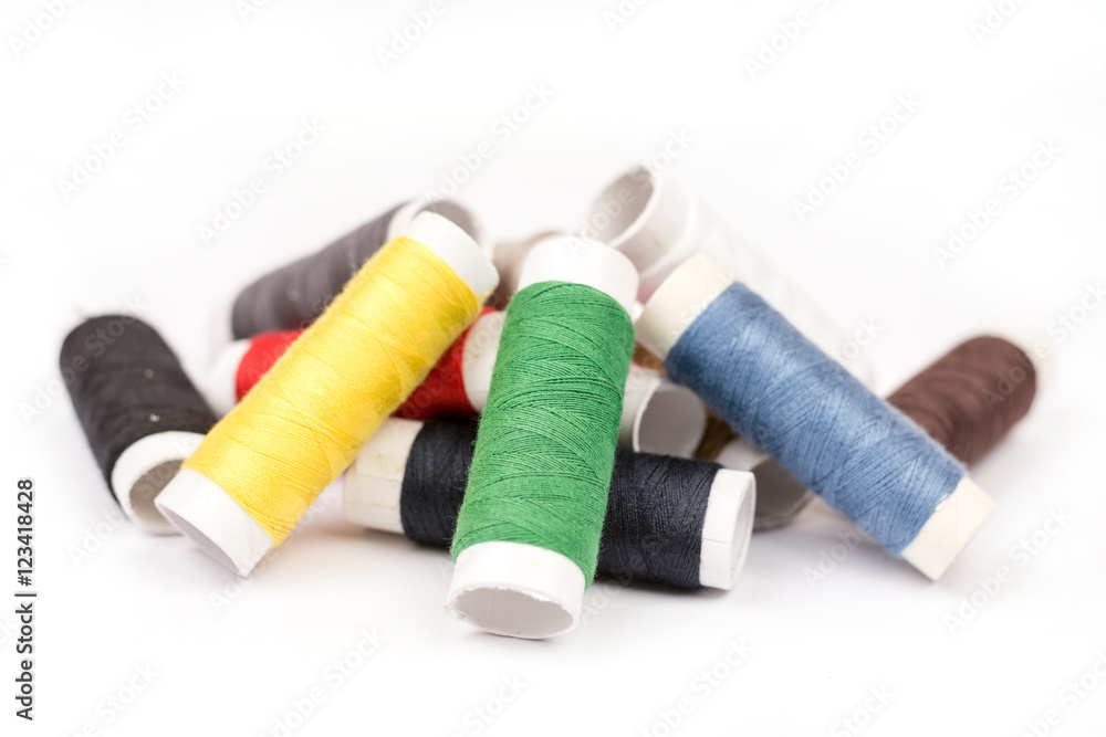 Pile of colorful threads over white background Pile of colorful threads over white background
