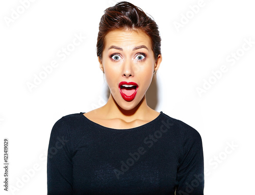 Cuadro en lienzo beautiful happy surprised sexy brunette woman in casual black dress with red lip