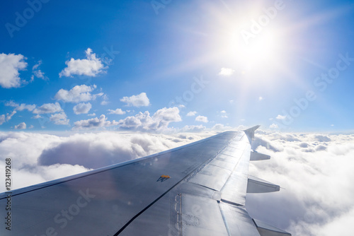 Wing of an airplane above the clouds