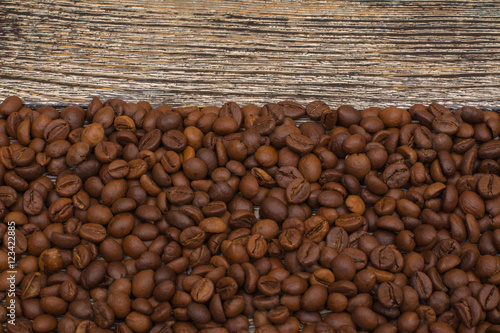 0062-0000001006........0062-0000001007 coffee beans on wooden background