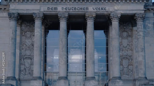 Real time tilt up medium shot of The German Parliament and the Deutche Bundestagin Berlin at evening time.
