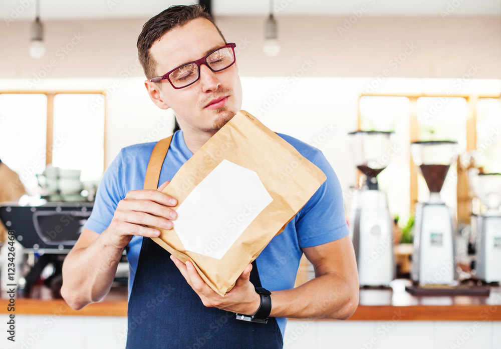 Package design template mockup. Man holding blank coffee package Package design template mockup. Man holding blank coffee package
