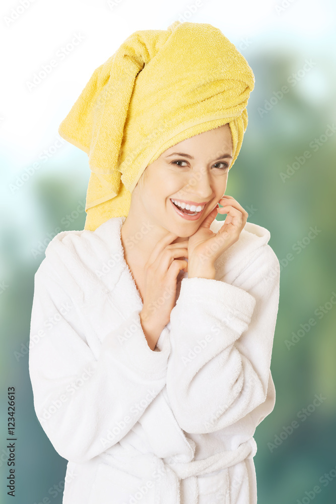 Young smiling woman in bathrobe Young smiling woman in bathrobe