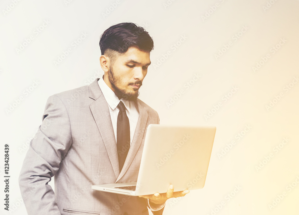Businessman holding a laptop go working,lifestyle Businessman holding a laptop go working,lifestyle