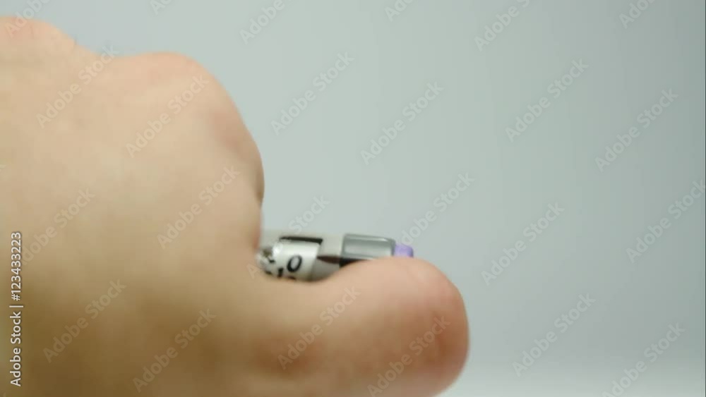 Man Finger Pushing The Button Of A Special Diabetes Syringe, Over Dose