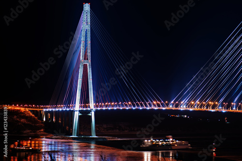 night view of the longest cable-stayed bridge in the world in the Russian Vladivostok over the Eastern Bosphorus strait to the Russky Island photo