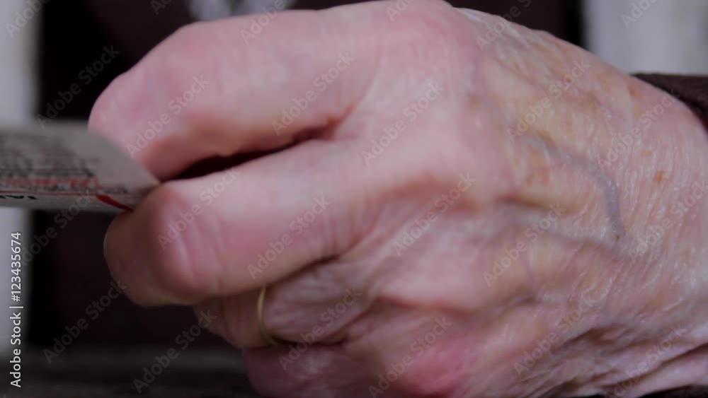 Hand Detail Of A Very Old Woman Holding A Calendar Page Hand Detail Of A Very Old Woman Holding A Calendar Page