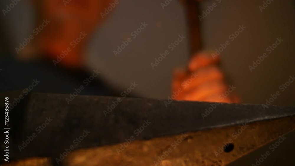 Blacksmith Forging Sword on an Anvil Low Angle Slow Motion Blacksmith Forging Sword on an Anvil Low Angle Slow Motion