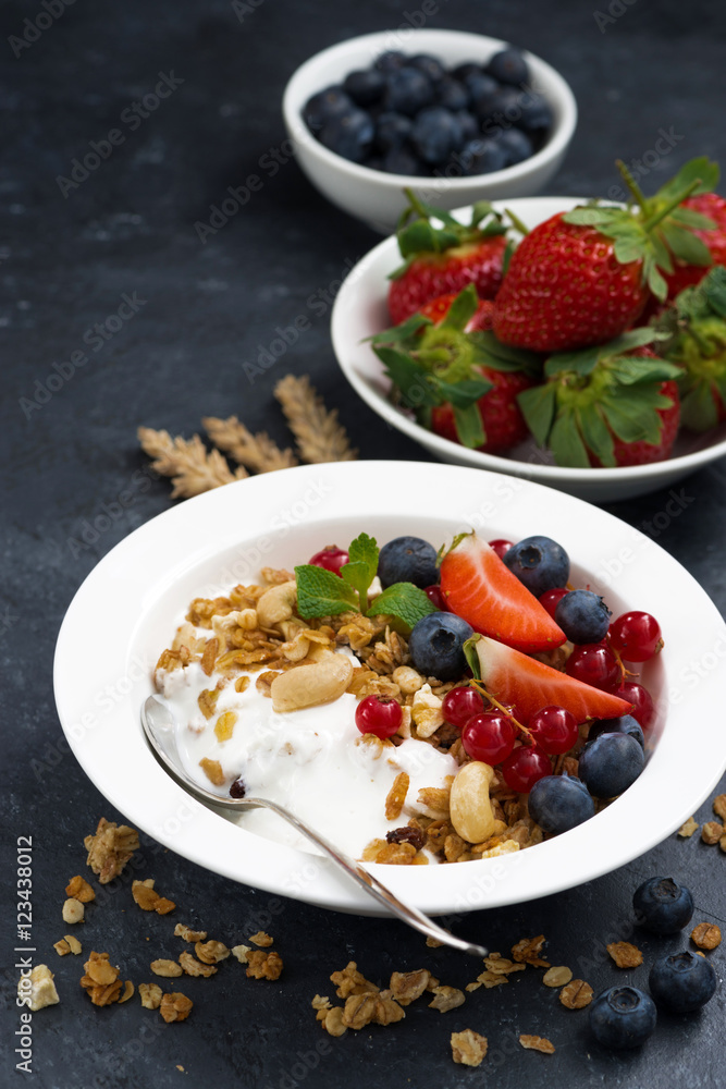 muesli with fresh berries and yogurt for breakfast, vertical muesli with fresh berries and yogurt for breakfast, vertical