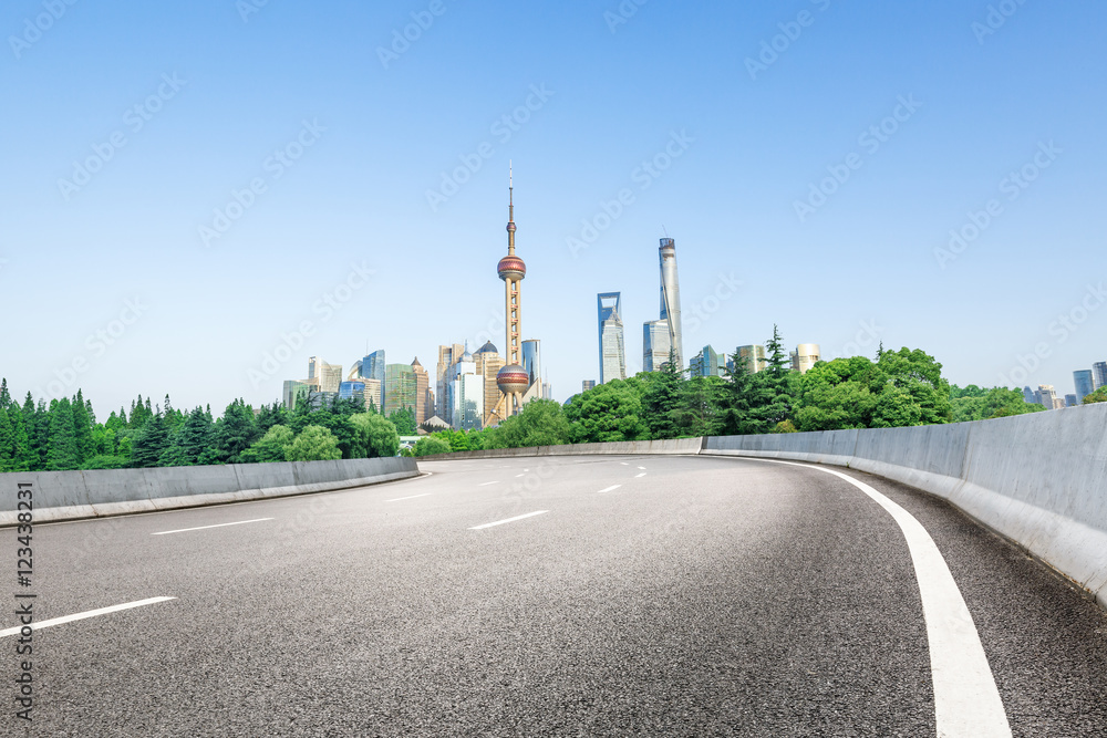 Shanghai skyscraper city scenery and new asphalt road in China